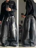 Jeans Baggy con Estampado Gráfico y Ojales
